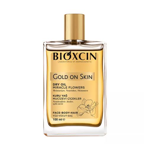 r444 اسپری روغن خشک بیوکسین Bioxcin برای پوست و مو مدل GOLD ON SKIN حجم 100 میل - تصویر 1